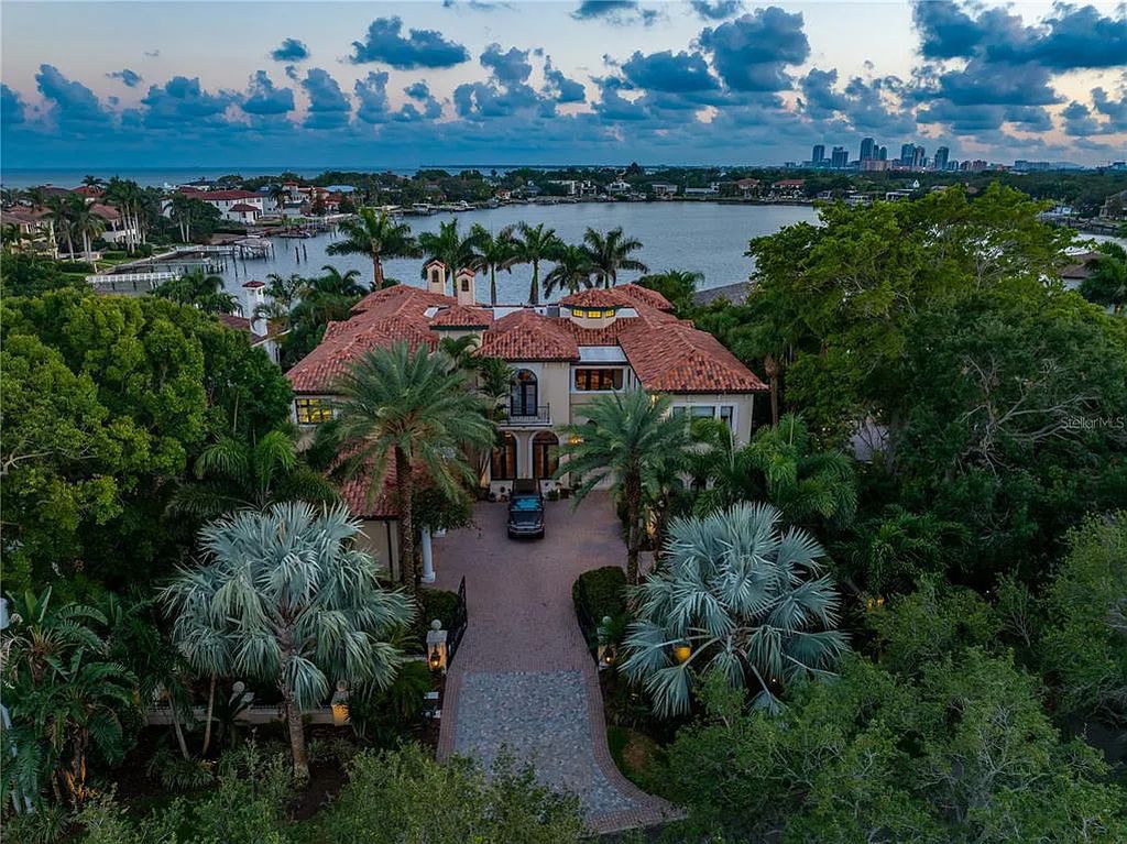 Experience luxury living at its finest with Bellissimo Palazzo at 2020 Brightwaters Boulevard NE, a prestigious waterfront estate in Saint Petersburg, Florida. This Italian-inspired masterpiece boasts 5 bedrooms, 9 bathrooms, and over 9,700 square feet of opulent living space. Immerse yourself in timeless architecture, exquisite finishes, and breathtaking waterfront views.