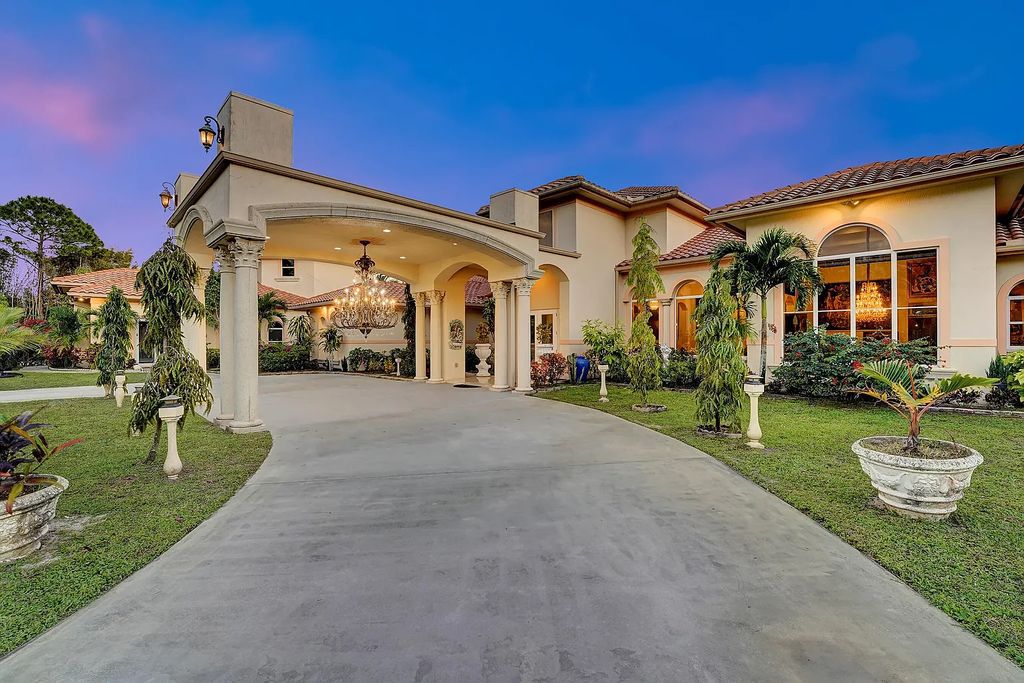 Welcome to 12198 40th Street S, Wellington, Florida! This magnificent luxury Mediterranean estate boasts over 10,000 square feet of living space with nine lavish bedroom suites. The property features meticulous landscaping, a grand foyer with marble flooring, and an open-concept layout blending formal and informal spaces.