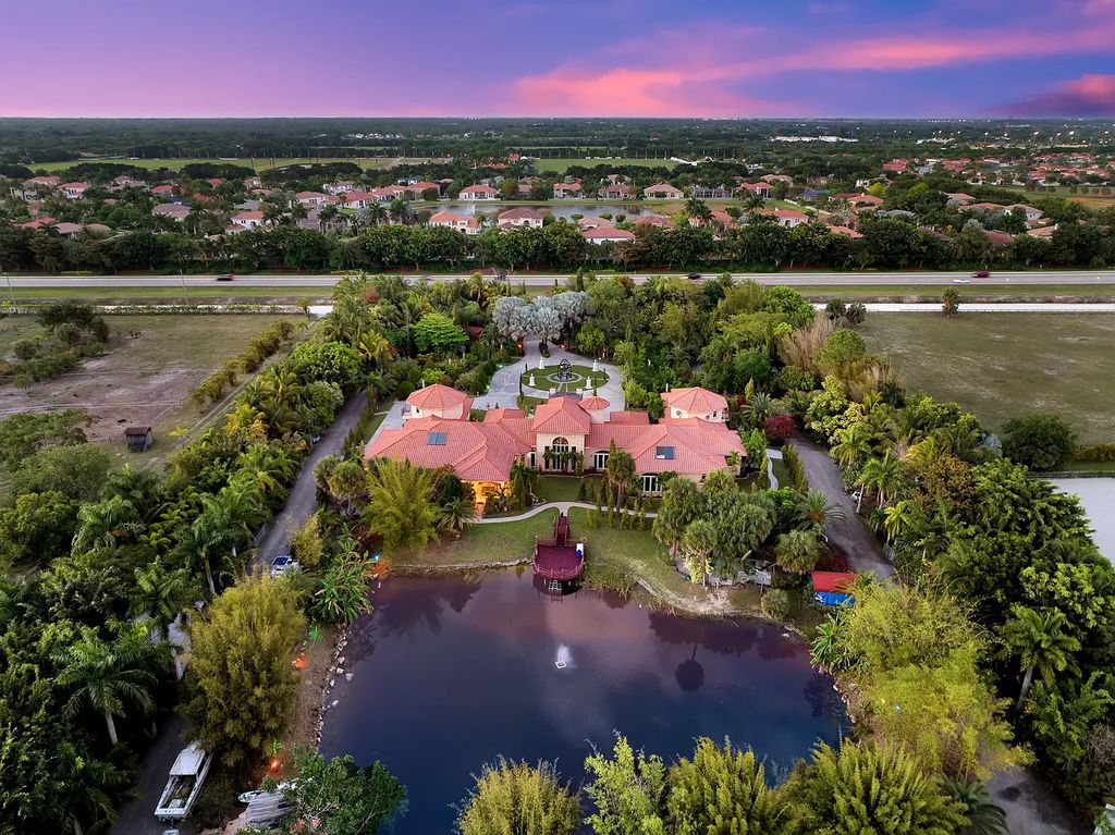 Welcome to 12198 40th Street S, Wellington, Florida! This magnificent luxury Mediterranean estate boasts over 10,000 square feet of living space with nine lavish bedroom suites. The property features meticulous landscaping, a grand foyer with marble flooring, and an open-concept layout blending formal and informal spaces.