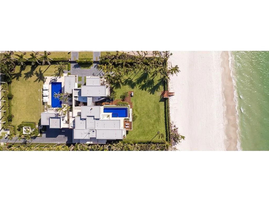 Introducing 25 16th Avenue S, a magnificent beachfront estate in Naples, Florida. This modern masterpiece, designed by Stofft Cooney Architects, LLC and constructed by Newbury North Associates, Inc., offers captivating views of Naples beach and the Gulf of Mexico.