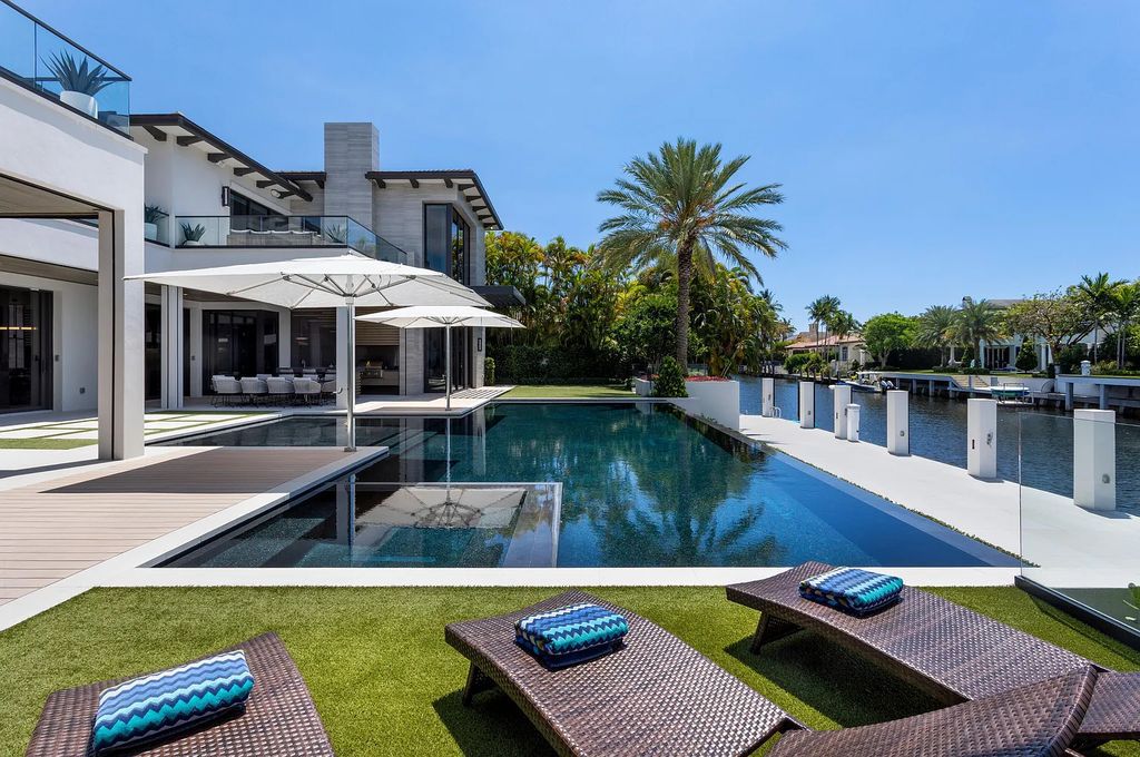 Introducing 144 W Coconut Palm Road, a gated Royal Palm deepwater estate in Boca Raton, Florida. This 7-bedrooms, 10-bathrooms home spans 8,671 square feet on a 0.44-acre lot.