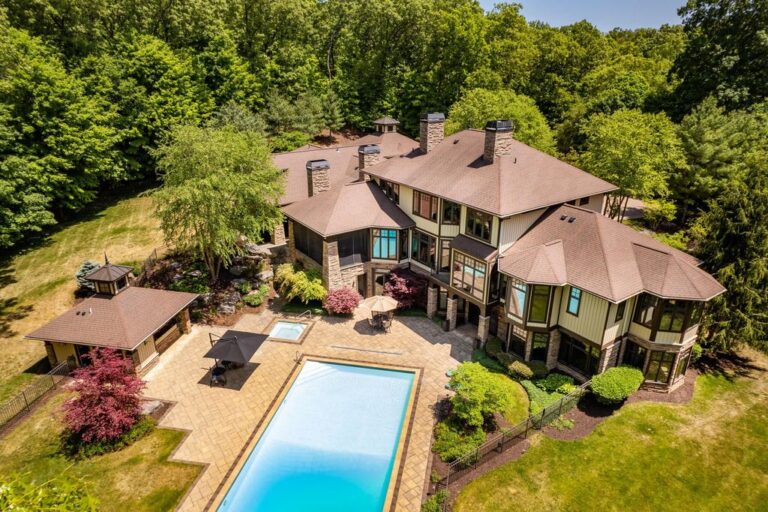 Unveiling an Exquisite Retreat: Captivating 5-Acre Wooded Estate in Skyevale’s Gated Community