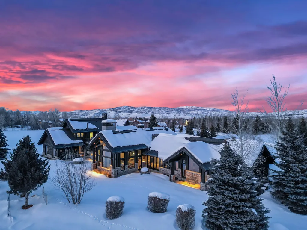 1032 Quarry Mountain Way Home in Park City, Utah. Discover this stunning modern mountain home in Park City's prestigious Quarry Mountain Ranch, offering breathtaking ski resort views and a feng shui inspired floor plan. Situated on 2.45 acres, the home boasts elegant finishes, spacious living areas, a gourmet kitchen, private owner's suite, and 4 guest suites. Enjoy a private tennis court, ponds for fishing, and proximity to top ski resorts and outdoor activities. 