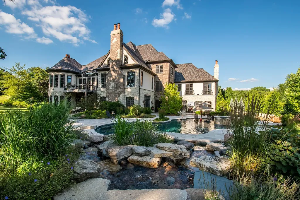 2 Rock Ridge Road Home in Barrington, Illinois. Discover the beauty of this one-of-a-kind estate in Barrington Hills, situated on 12.3 acres of picturesque land. This stunning home showcases expert craftsmanship, finest materials, and luxurious amenities. 