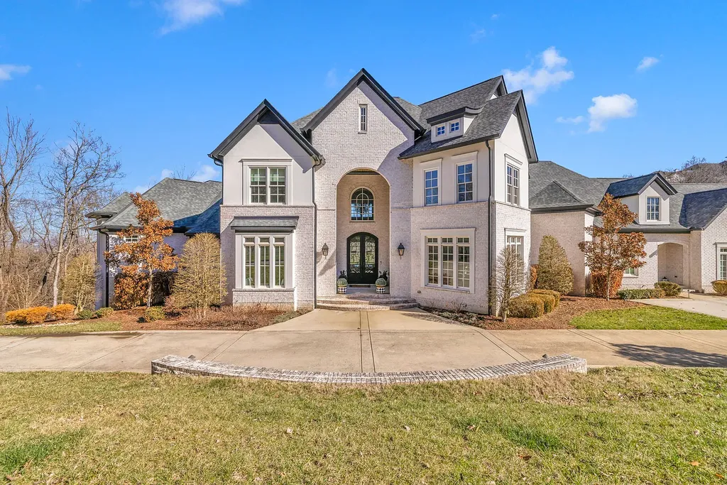 301 Lionheart Way Home in Franklin, Tennessee. Explore this exquisite gated home nestled in the hills of Franklin, TN, offering privacy and breathtaking views. Enjoy the convenience of nearby Cool Springs and I-65 while reveling in the tranquility of 1.4 acres of lush landscape. 