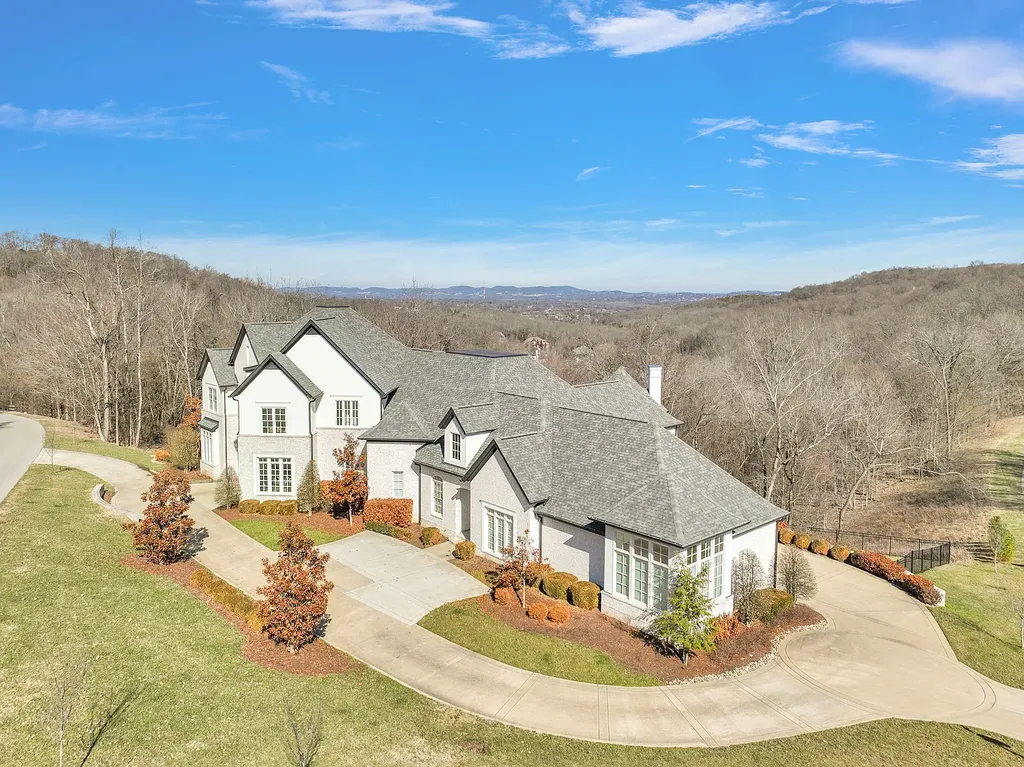 301 Lionheart Way Home in Franklin, Tennessee. Explore this exquisite gated home nestled in the hills of Franklin, TN, offering privacy and breathtaking views. Enjoy the convenience of nearby Cool Springs and I-65 while reveling in the tranquility of 1.4 acres of lush landscape. 
