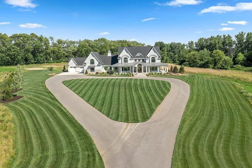 4680 76th Street South West Home in Byron Center, Michigan. Discover this remarkable custom-built home situated on a stately 12-acre estate in the heart of West Michigan. This exquisite property offers a luxurious living experience with superb finishes, soaring ceilings, and an impressive entryway. 