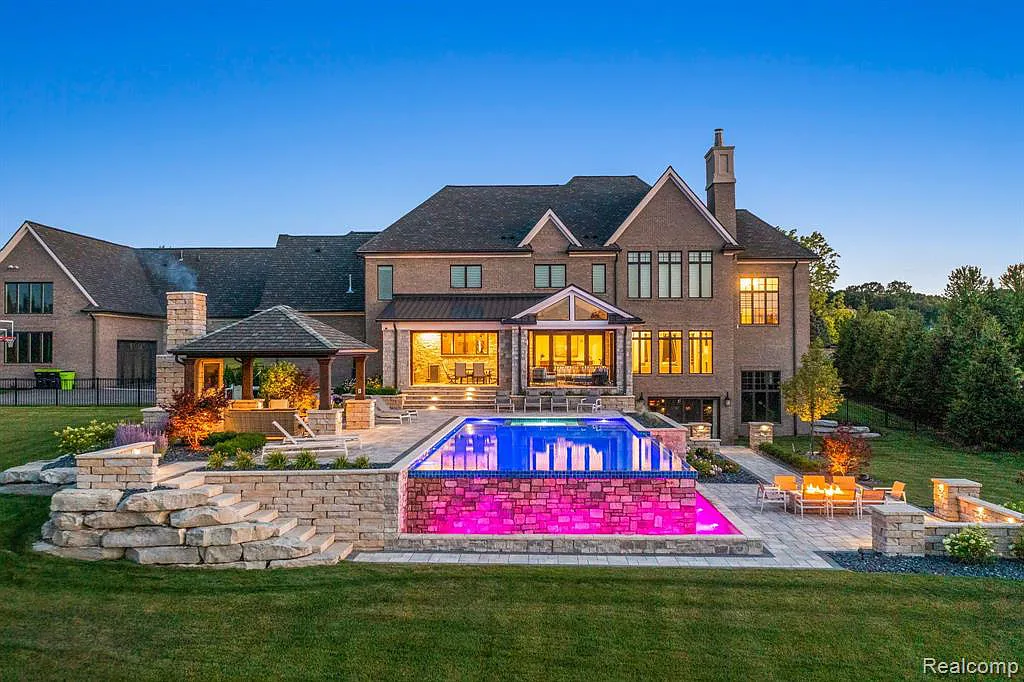 5105 Orchard Ridge Drive Home in Rochester, Michigan. Discover the epitome of luxury living in the prestigious gated community of Orchard Ridge. This custom-built masterpiece spans over 10,000 square feet, boasting impeccable craftsmanship, exquisite finishes, and a private 2-acre oasis.