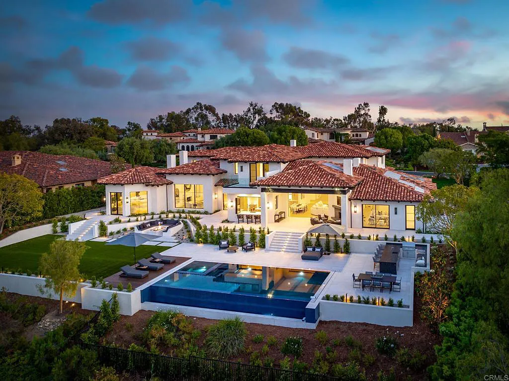 6722 Calle Ponte Bella Home in Rancho Santa Fe, California. Introducing the extraordinary Bridges Estate masterpiece, a brand new custom home in 2023 that offers exceptional views of both the 1st and 18th fairways of the prestigious Bridges at Rancho Santa Fe. Designed by renowned architect Mark Radford and built by Josh Herbst, this impeccable home showcases a seamless blend of high-end finishes, impeccable design, and abundant natural light. Located within the esteemed Roger Rowe School District, this property sets a new standard of luxury living.