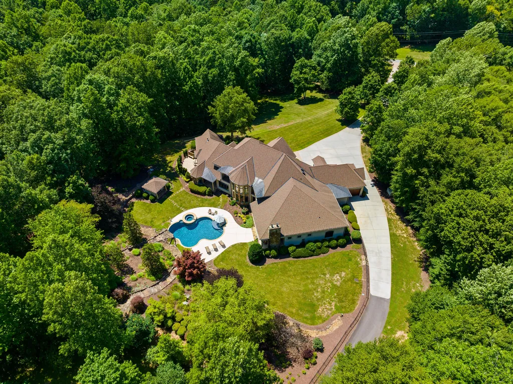8451 Ridgewood Road Home in Sherrills Ford, North Carolina. Embrace a life of luxury and sophistication in this exceptional waterfront retreat set on over 11 acres. This rare listing offers a stunning home with breathtaking design, premium amenities, and an idyllic location. Entertain guests in the spacious living areas and gourmet kitchen with top-of-the-line appliances.