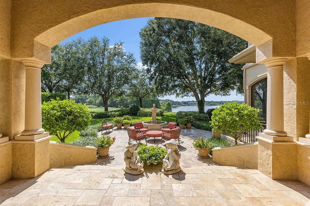 Discover elegance and luxury at 5200 Isleworth Country Club Drive in Windermere, Florida. This magnificent 5-bed, 8-bath estate with 9,482 sq ft of living space is situated on the eighth fairway of the Isleworth Golf and Country Club golf course, offering breathtaking views of Lake Bessie