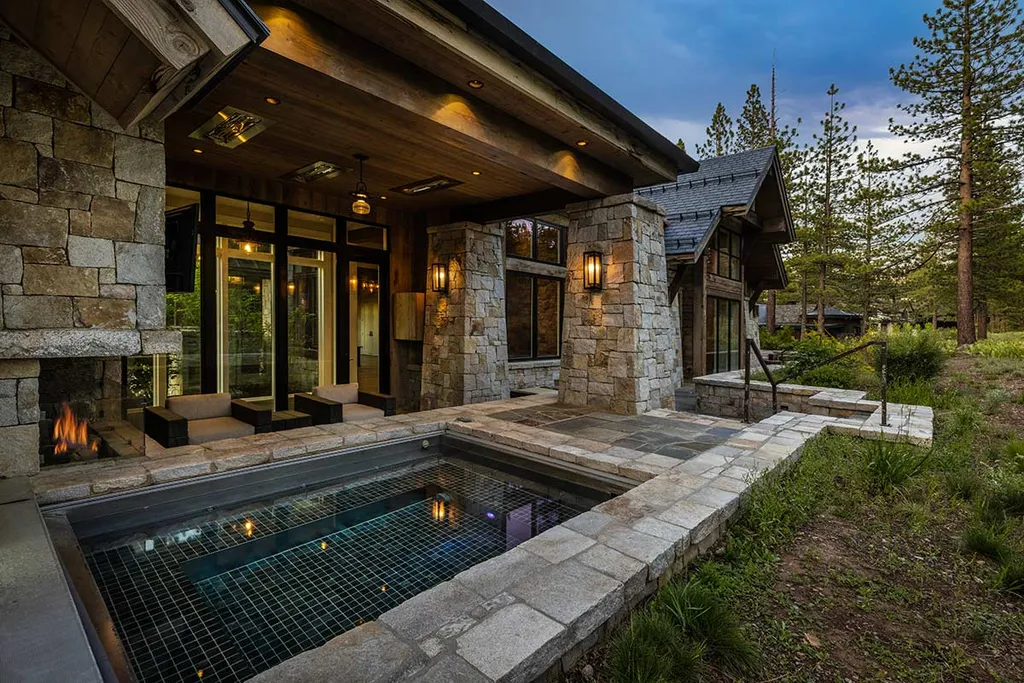 9661 Dunsmuir Way Home in Truckee, California. Prepare to be captivated as you step through the front door of this extraordinary 7,546-square-foot modern mountain home in Martis Camp. The first glimpse is nothing short of awe-inspiring—a vast expanse of glass that serves as both a wall and a stunning 288-bottle wine cellar. This artistic flair extends throughout the 6-bedroom, 7-bathroom residence, creating a truly unique and rewarding living experience.