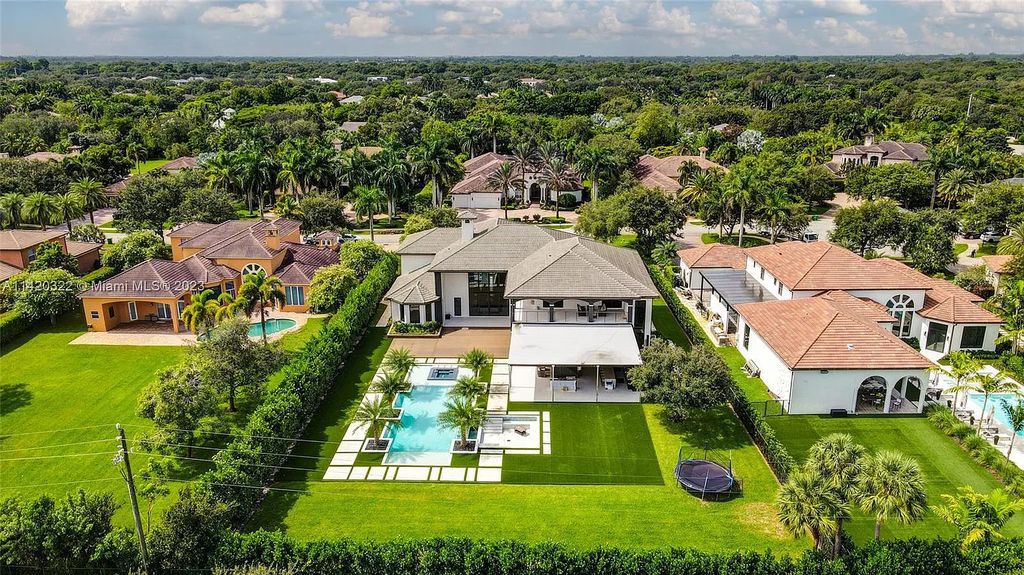 Welcome to 12887 Equestrian Trial, Davie, Florida – a fully remodeled masterpiece with top-quality finishes and no expense spared. This extraordinary home features 8 beds, 10 baths, 9,346 sq. ft. of living space, and sits on a 0.90-acre lot built in 2008