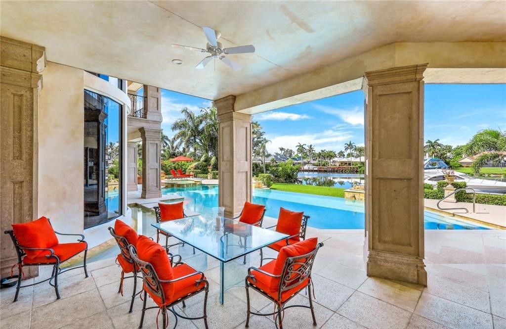 Presenting 1030 Galleon Drive, a remarkable custom home in the prestigious Port Royal neighborhood of Naples, Florida. This one-of-a-kind property sits on an oversized lot with over 160 feet of water frontage, offering stunning views and privacy.