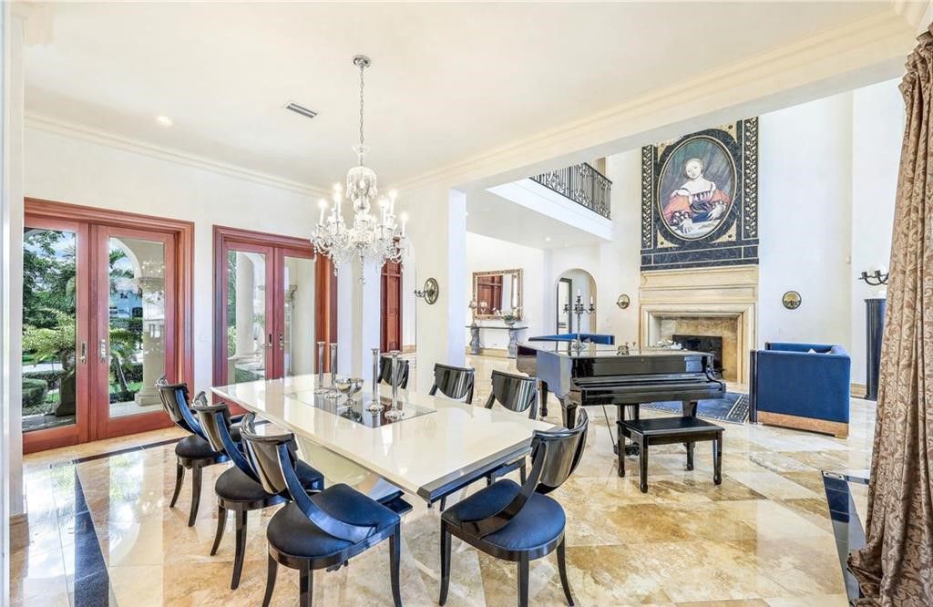 Presenting 1030 Galleon Drive, a remarkable custom home in the prestigious Port Royal neighborhood of Naples, Florida. This one-of-a-kind property sits on an oversized lot with over 160 feet of water frontage, offering stunning views and privacy.