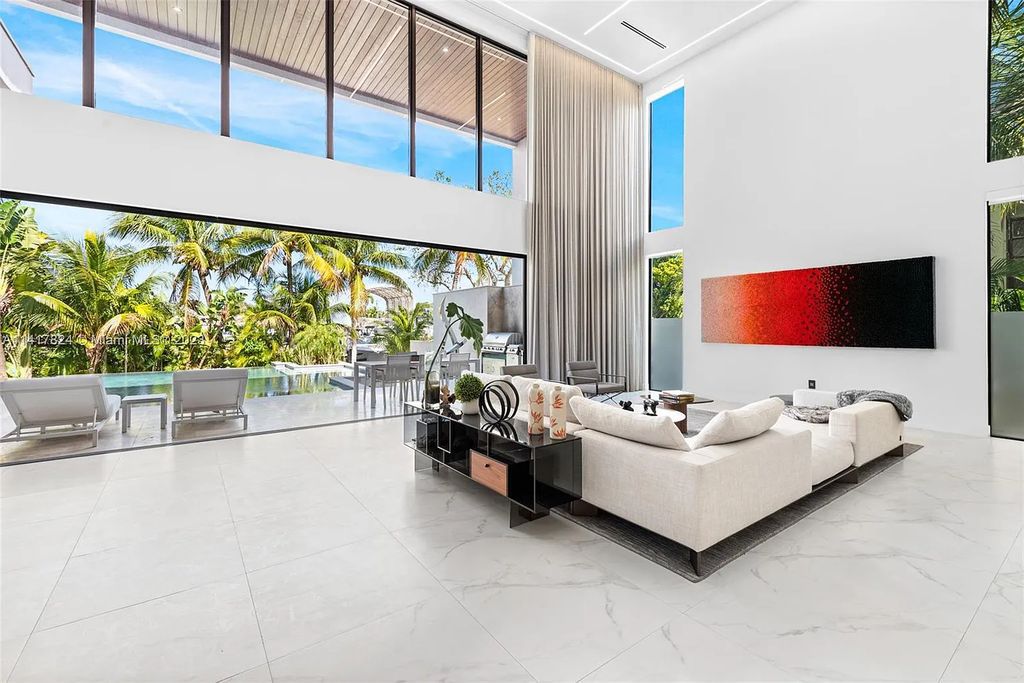 Welcome to 775 NE 77th Terrace, a luxurious new construction in Miami's exclusive Belle Meade community. This stunning 6-bedroom, 7-bathroom home boasts over 6,900 square feet of living space and impeccable craftsmanship throughout.