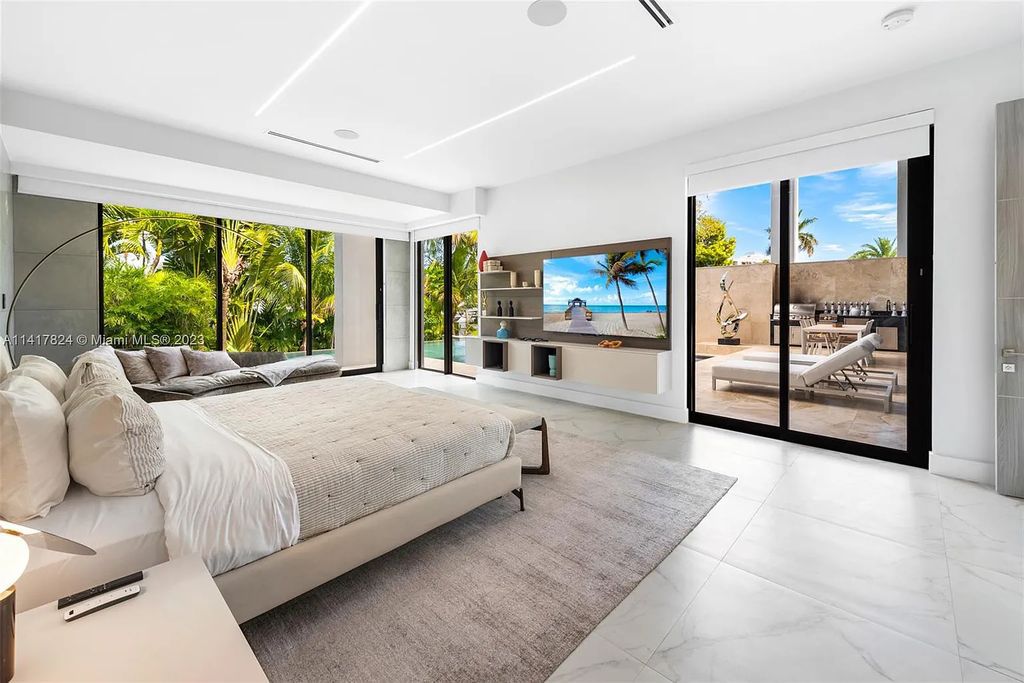 Welcome to 775 NE 77th Terrace, a luxurious new construction in Miami's exclusive Belle Meade community. This stunning 6-bedroom, 7-bathroom home boasts over 6,900 square feet of living space and impeccable craftsmanship throughout.