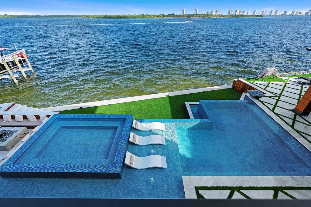 Introducing 1020 Fairview Lane, the crown jewel of Singer Island in Riviera Beach, Florida. This extraordinary waterfront property in Palm Beach Isles offers stunning waterway views, 200 feet of frontage, and direct access to the Palm Beach Inlet.