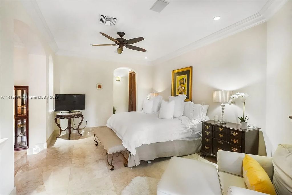 Welcome to Villa di Vista, an exquisite 6-bed, 7-bath masterpiece in  12500 Vista Lane, Pinecrest, Florida. With 7,536 sqft of luxury, high ceilings, and abundant natural light, this custom-built estate exudes charm
