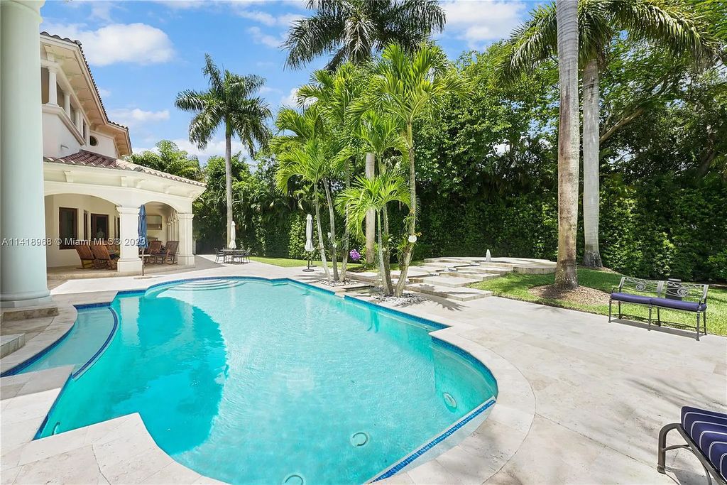 Welcome to Villa di Vista, an exquisite 6-bed, 7-bath masterpiece in  12500 Vista Lane, Pinecrest, Florida. With 7,536 sqft of luxury, high ceilings, and abundant natural light, this custom-built estate exudes charm