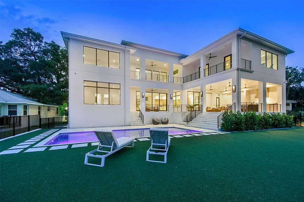 Welcome to 104 Ladoga Avenue, a new waterfront residence on Davis Islands in Tampa, Florida. This architectural masterpiece offers 6 bedrooms, 7.5 bathrooms, and 7,416 square feet of luxurious living space.