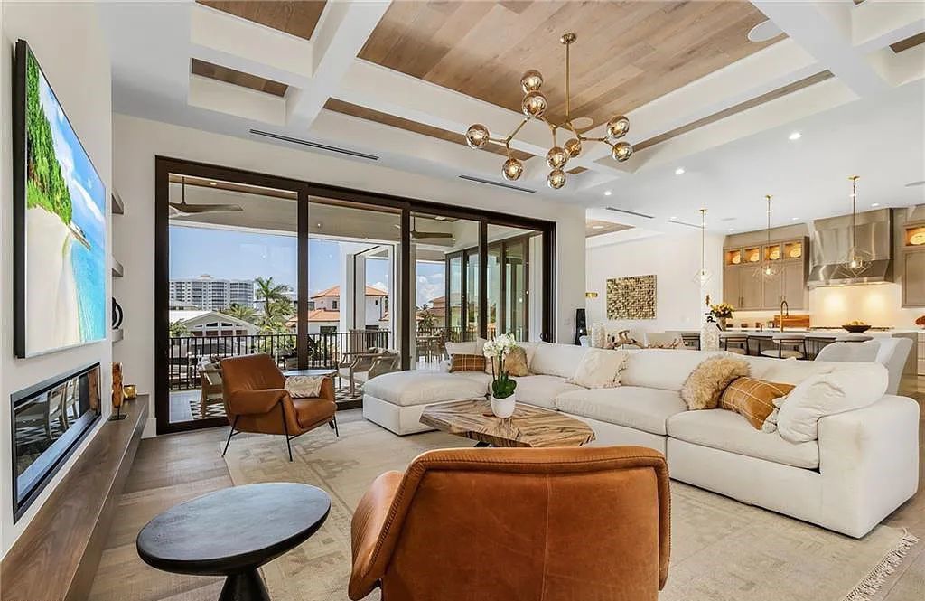 Experience the epitome of luxury living at 241 Egret Avenue, an impressive waterfront gulf access home in Naples, Florida. This newly built three-story residence boasts 5 bedrooms, 7 baths, and a wealth of upscale features.