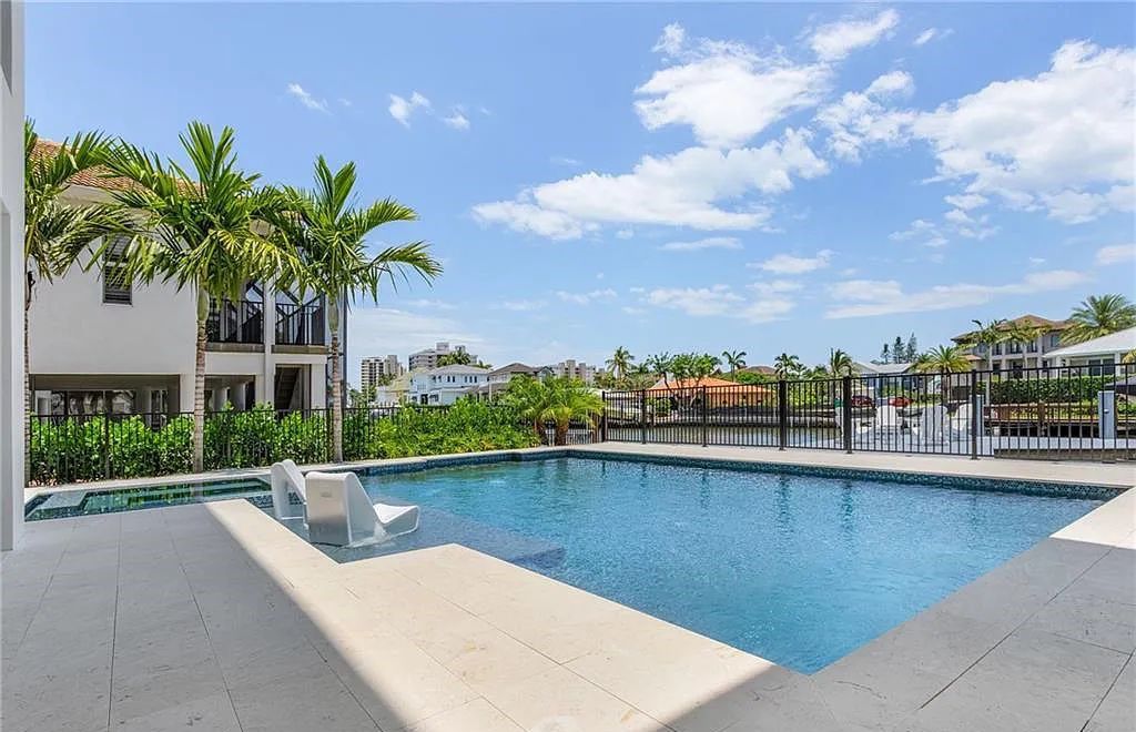 Experience the epitome of luxury living at 241 Egret Avenue, an impressive waterfront gulf access home in Naples, Florida. This newly built three-story residence boasts 5 bedrooms, 7 baths, and a wealth of upscale features.