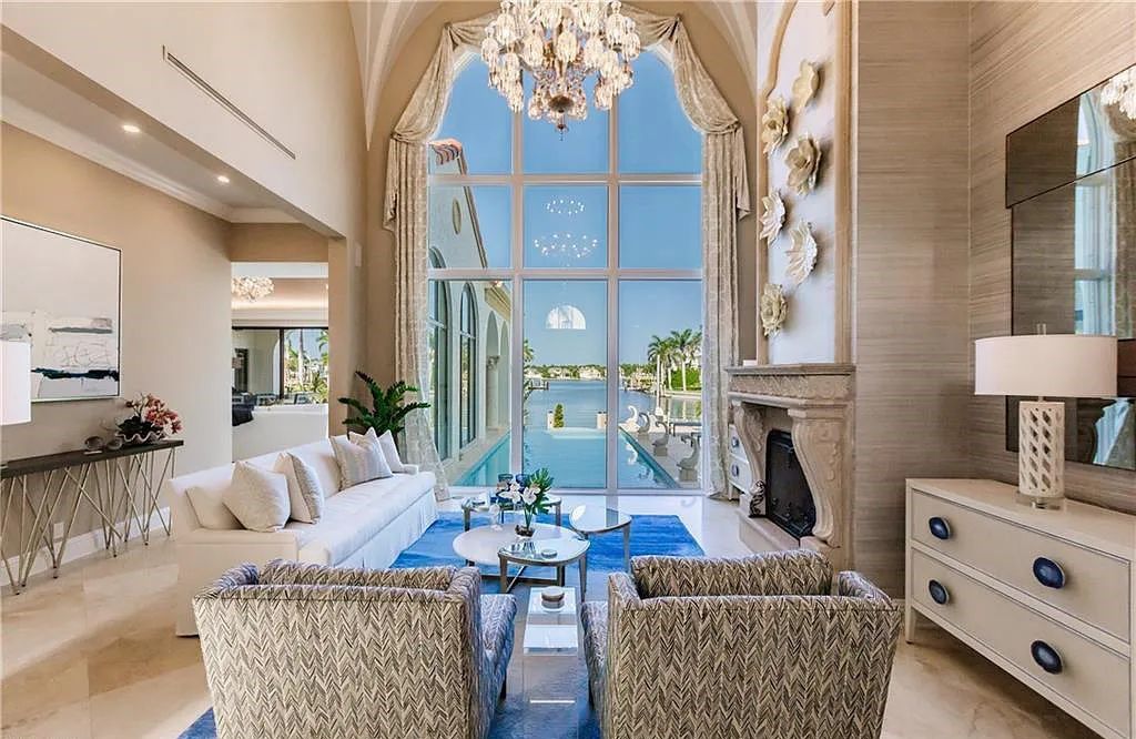 Discover the ultimate Naples, Florida retreat at 2450 Tarpon Road, "The Gateway to Naples Bay." This exceptional property offers a luxurious 4+den/4.5 bath home with 4,450 square feet of living space, recently re-decorated and furnished by Clive Daniel