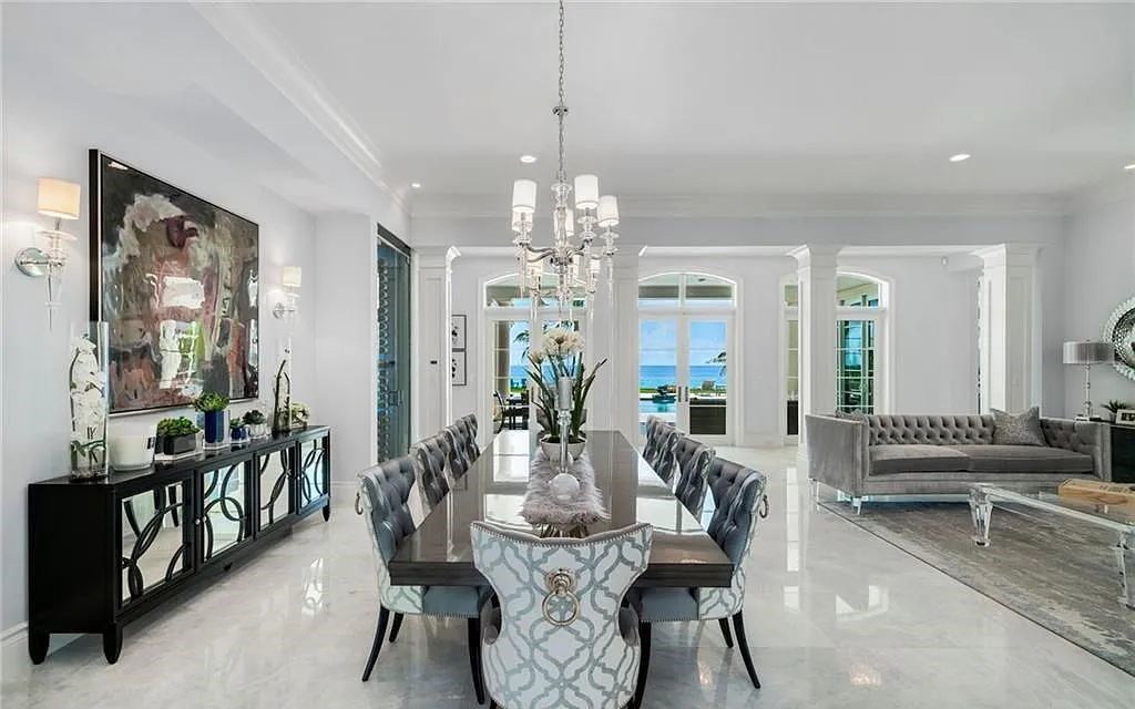 Welcome to 1001 Hillsboro Mile, a stunning oceanfront estate on Florida's Magnificent Mile. This custom-built property features 6 bedrooms, 11 bathrooms, and 12,640 square feet of living space.