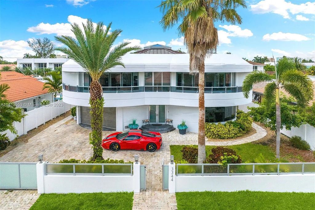 Experience the epitome of modern luxury living at 3344 NE 167th Street, North Miami Beach, Florida! This sleek, all-modern mansion boasts 6 bedrooms, 7 bathrooms, and 6,669 square feet of living space. Built in 2007, it offers an 80 ft waterfront with an outfitted dock, and an elevator.