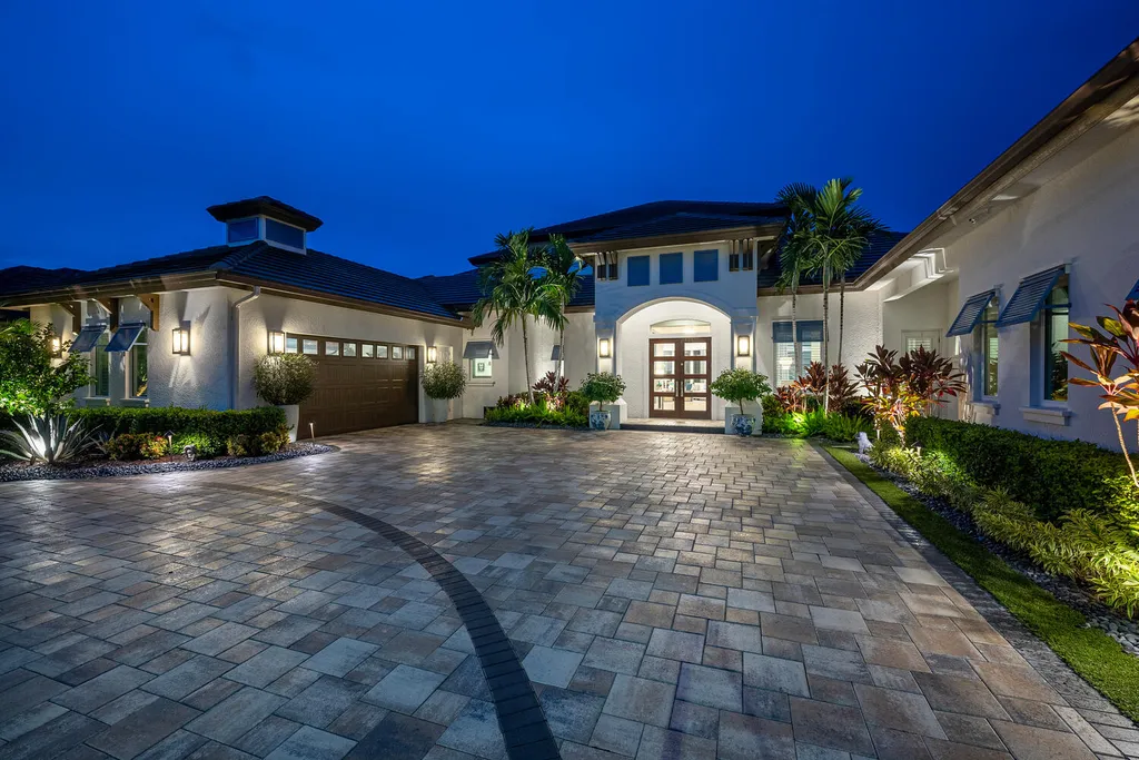 11910 Via Salerno Way Home in Miromar Lakes, Florida. Discover the epitome of luxury living in this exquisitely designed waterfront estate home, set on a private double homesite in the prestigious Miromar Lakes community. This stunning residence boasts grand architectural details, a chef's kitchen with top-of-the-line appliances, white oak wood flooring, and a backup generator.