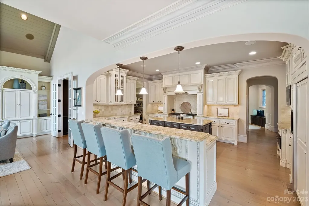 12144 James Jack Lane Home in Charlotte, North Carolina. Discover the epitome of luxury living in this stunning estate nestled on a private cul-de-sac lot with breathtaking views of the 12th and 13th holes of Ballantyne Country Club's finest golf course. 