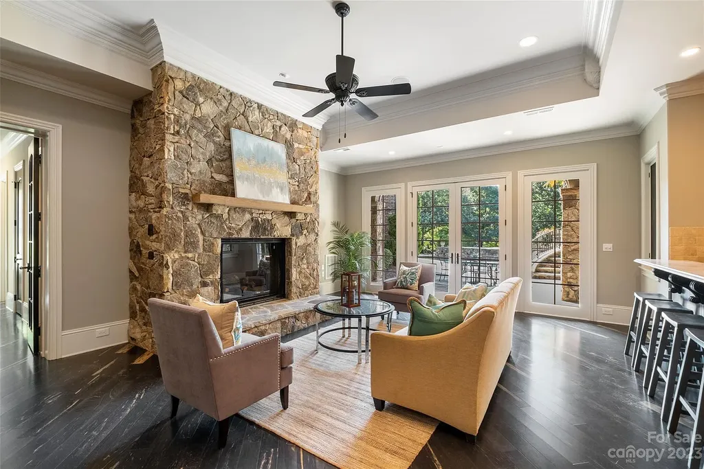 12144 James Jack Lane Home in Charlotte, North Carolina. Discover the epitome of luxury living in this stunning estate nestled on a private cul-de-sac lot with breathtaking views of the 12th and 13th holes of Ballantyne Country Club's finest golf course. 