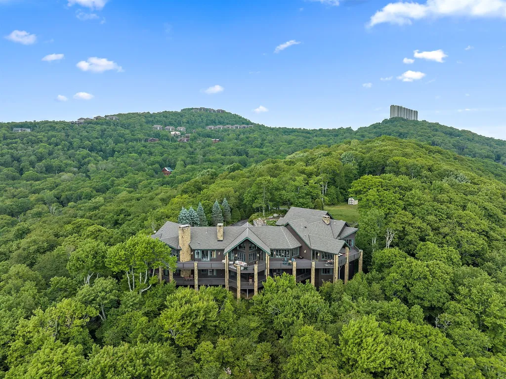 1705 Forest Ridge Drive Home in Linville, North Carolina. Discover the epitome of luxury living in this immaculate mountain estate within the exclusive gated community of Linville Ridge. Nestled on over 12 acres, this home offers seclusion and stunning views.