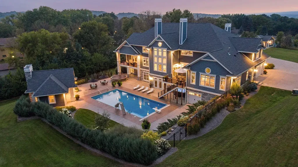 1811 Crestview Court Home in Red Wing, Minnesota. Experience luxury living in this exceptional custom home nestled on five acres of picturesque landscape in Red Wing. With six bedrooms, seven baths, and an eight-stall garage, this property offers unmatched comfort and elegance.