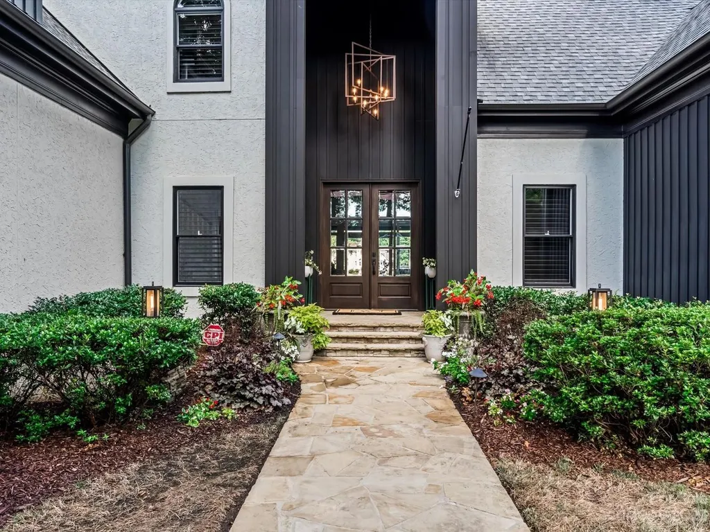 18417 Peninsula Cove Lane Home in Cornelius, North Carolina. Immerse yourself in luxury with this meticulously renovated estate-style home, graced with stunning views of Lake Norman and Peninsula Golf Course from nearly every corner. 