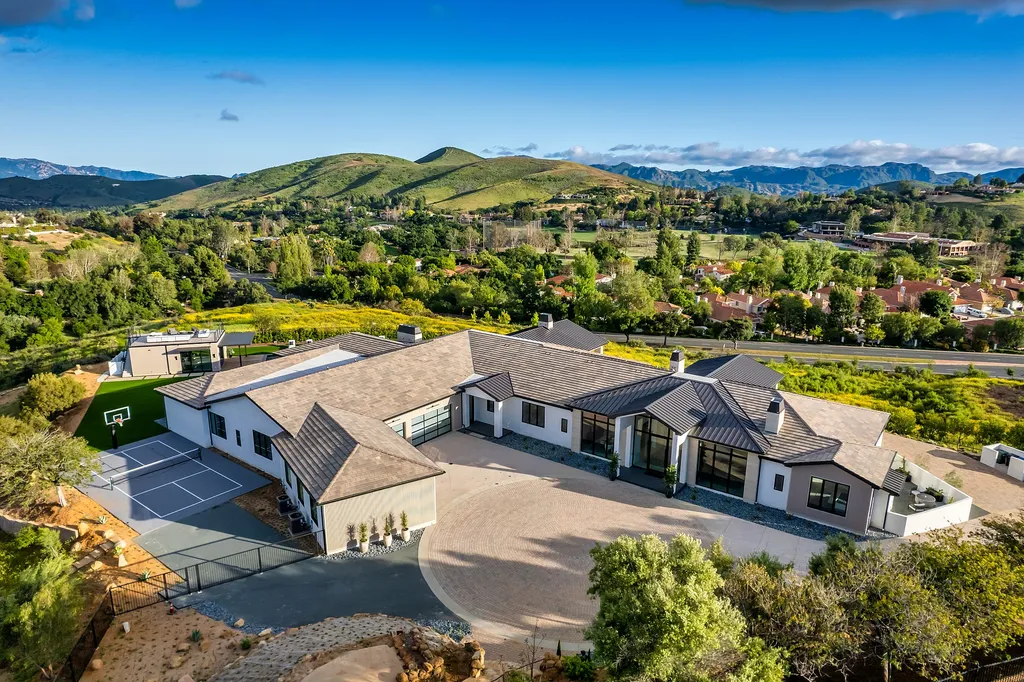 1856 Dawn Meadow Street Home in Thousand Oaks, California. Discover the pinnacle of luxury living in this newly constructed contemporary masterpiece nestled in North Ranch's High Country section. With 11,000 square feet of single-story opulence, this 6-bedroom, 9-bathroom home features a theater, wine wall, game room, and more. 