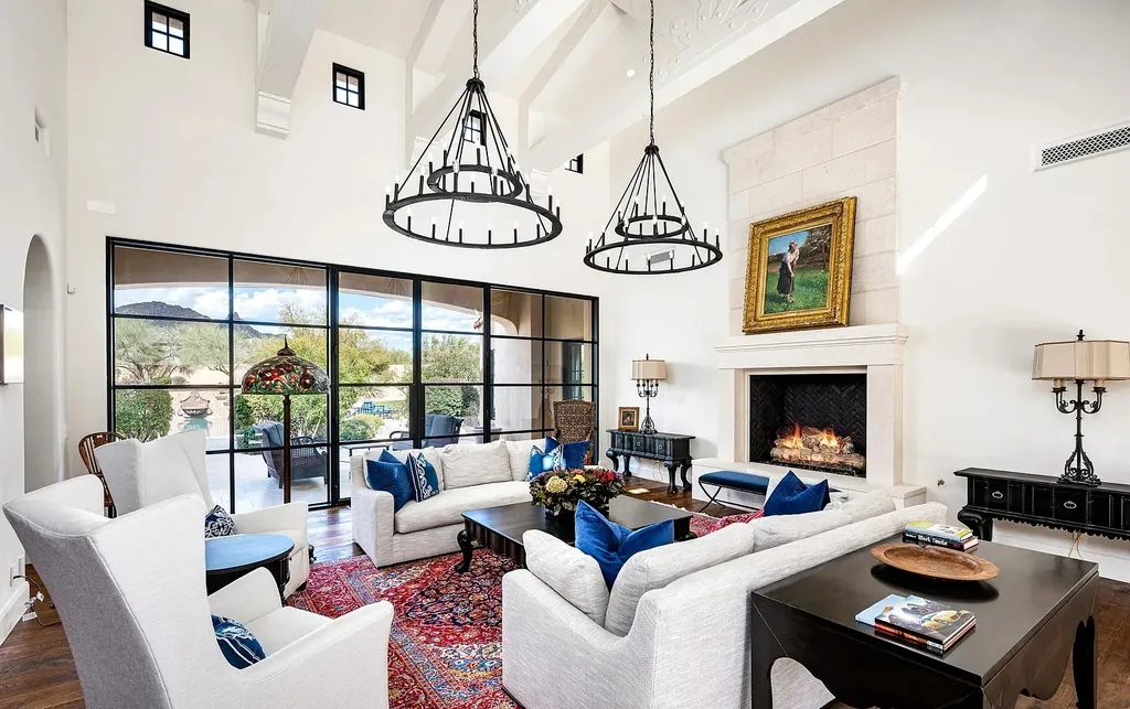 24546 North 91st Street Home in Scottsdale, Arizona. Discover the epitome of modern luxury at this renovated Modern Spanish estate in Prado Estates. Crafted by Mike Graham of American First Builders, the property showcases sweeping mountain and city views across its rare 4.7-acre lot.