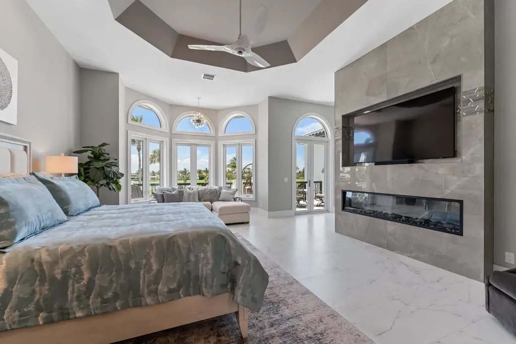 3057 SE Dune Drive Home in Stuart, Florida. Discover this artfully reimagined and fully renovated home boasting panoramic views of a Jack Nicklaus golf course, the lake, and the ocean. Flooded with natural light through 166 windows, the neutral palette accentuates exquisite finishes and architectural details. 