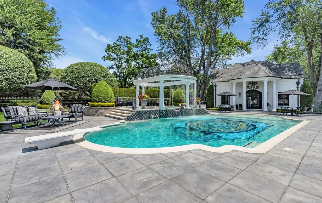 4 Bellaire Court Home in Colts Neck, New Jersey. Discover the epitome of luxury living in this meticulously maintained custom estate home adorned with high-end designer materials throughout. Surrounded by mature landscaping, this stunning property offers ultimate privacy and tranquility.