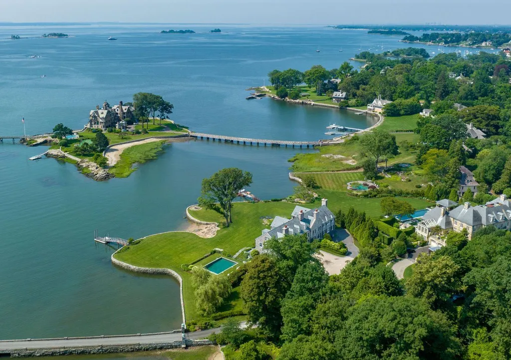 545 Indian Field Road Home in Greenwich, Connecticut. Discover coastal luxury at its finest in this exquisite stone Georgian Colonial nestled within the prestigious Mead Point Association. With panoramic views of Long Island Sound and direct waterfront access, this masterfully designed residence offers over 12,000 square feet of living space on four levels.