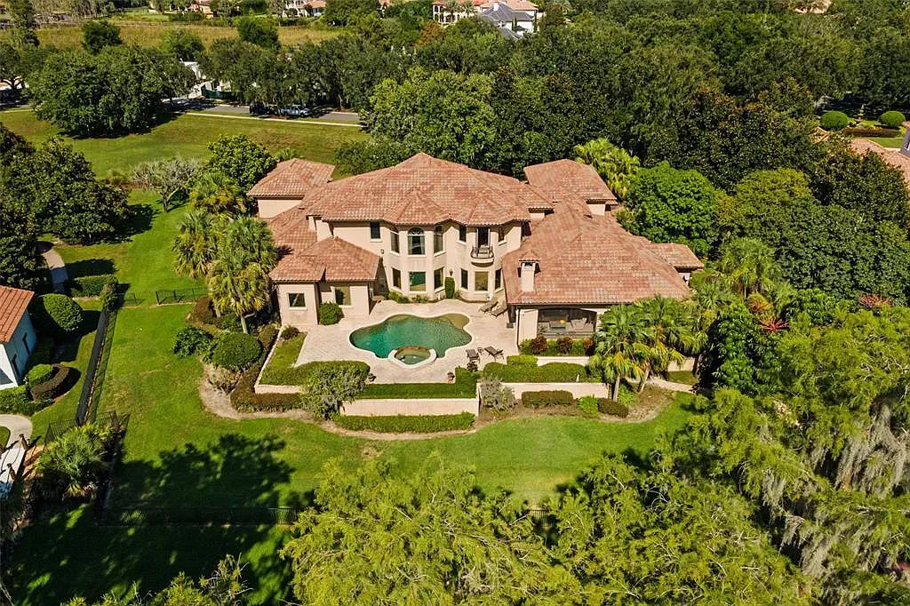 6120 Kirkstone Lane Home in Windermere, Florida. Welcome to a captivating lakefront estate that embodies luxury living at its finest. This exquisite custom-built home boasts unparalleled beauty and sophistication with meticulous attention to detail and premium materials.