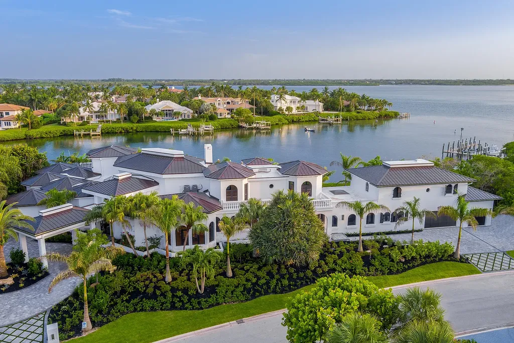 6440 SE Harbor Circle Home in Stuart, Florida. Discover unparalleled luxury living in this iconic waterfront property, a true treasure of the Treasure Coast. Situated within the prestigious guard-gated community of Sailfish Point, this home is perched on an exquisite waterfront lot with easy ocean access and breathtaking views.
