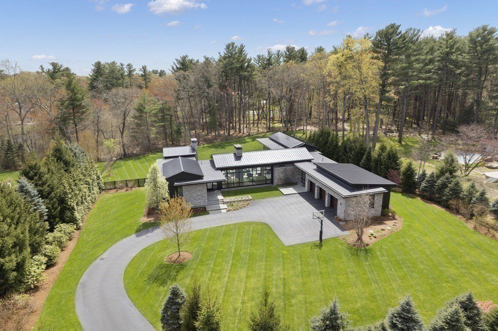 $8.45 Million Luxury Home in Weston, Massachusetts: Seamless Indoor-Outdoor Living Amidst Picturesque Landscaping