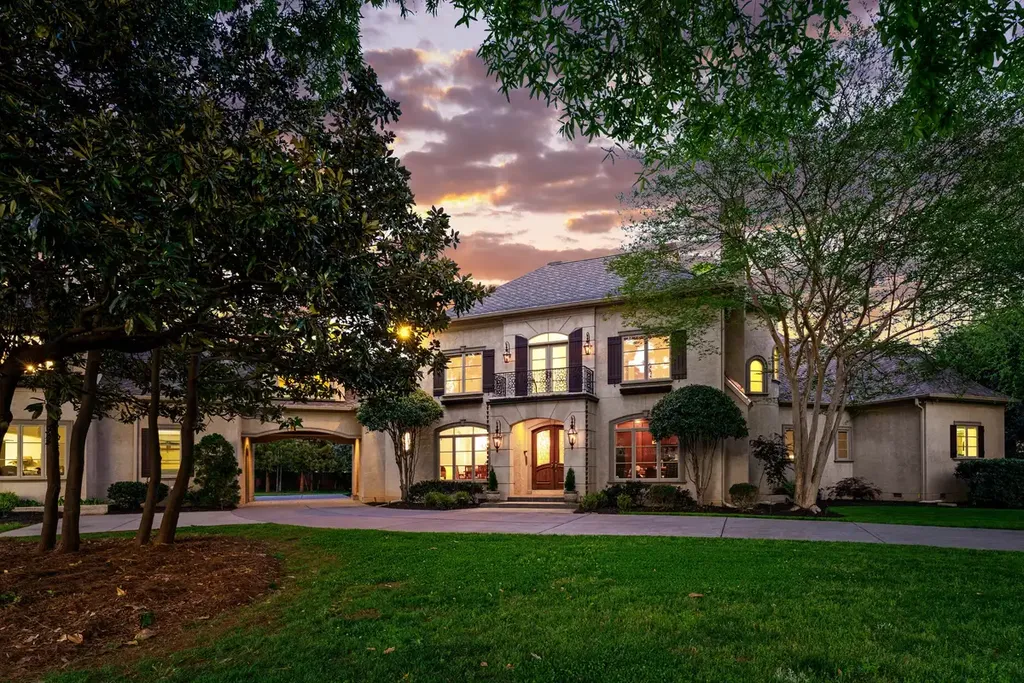 8600 Fairview Road Home in Charlotte, North Carolina. Discover the epitome of luxury living at Fairview Manor Estate in the coveted Carmel Park neighborhood. This gated 1.27-acre property boasts a stunning great room with a 2-story fireplace, exquisite millwork, and floor-to-ceiling windows. 