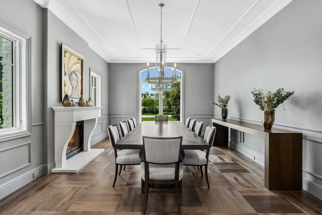 8840 SW 61st Court Home in Pinecrest, Florida. Explore this exquisite European-inspired home in N. Pinecrest, boasting 7 bedrooms and 7.5 bathrooms. From the formal living room with a wine cellar to the showstopper kitchen, this residence exudes elegance and sophistication.