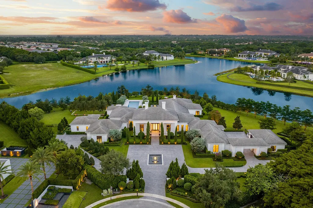 9303 Hawk Shadow Lane Home in Delray Beach, Florida. Villa Ananda is a luxurious contemporary mansion in Delray Beach, Florida, offering an exquisite blend of privacy, technology, and opulence. Nestled within the exclusive Stone Creek Ranch community, this 17,031 sq ft estate sits on a sprawling 2.5-acre lakefront property, providing breathtaking water views from almost every room.