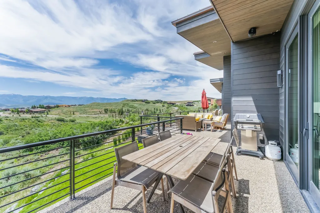 9310 Golden Spike Court Home in Park City, Utah. Discover this extraordinary custom home nestled on a 1.59-acre lot in Promontory's sought-after Summit neighborhood. Boasting stunning stone and cedar architecture under a striking copper roof, this home offers unobstructed ski area views and direct access to acres of open space. 