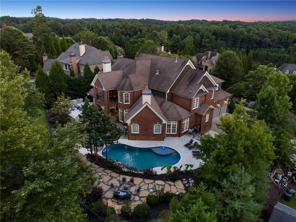 Majestic Estate: Highlighting a Resort-Style Pool and Outdoor Living Space Offered at $3.299 Million in Milton, Georgia