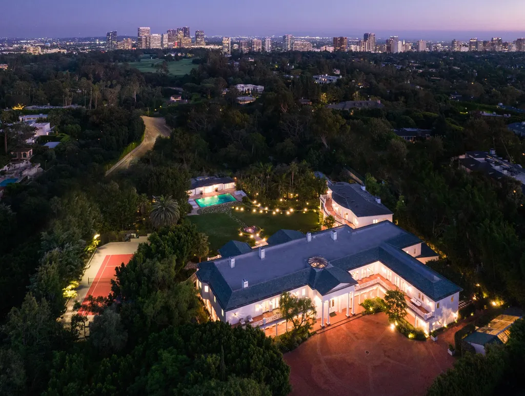 10250 West Sunset Boulevard Home in Los Angeles, California. Discover the epitome of luxury living at this meticulously reimagined Paul Williams designed estate in Holmby Hills, spanning approximately 2.8 acres. Comprising three structures with nearly 30,000 SF of living space, this world-class property offers unrivaled privacy, an expansive motor court, 14 bedrooms, 25 baths, and an array of amenities including a theater, game room, and a wellness-focused pool house. 